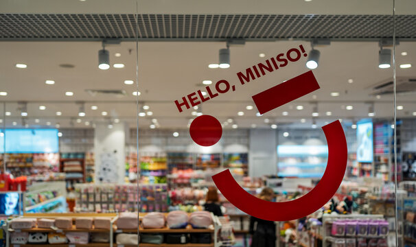 Miniso store interior. The inscription "Hello, Miniso!" on the glass of a shop window. Miniso is a Chinese low cost retailer and variety store chain. Minsk, Belarus - April 10, 2024