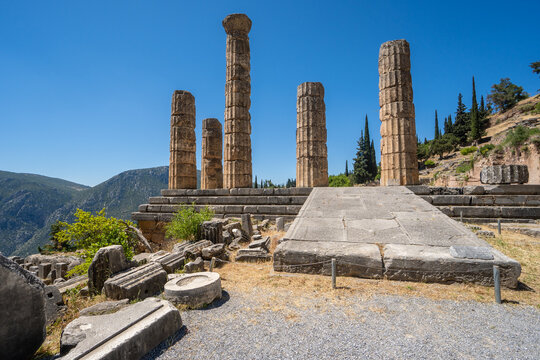 Ground-Level Perspective of the Temple of Apollo and Doric Columns in the Sanctuary of Delphi, Greece