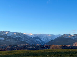 Obraz premium Puigcerda town with Pyrenees mountains and blue sky