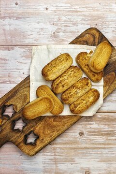 Polvorones and mantecados, traditional Christmas cakes from Andalusia, Spain, on wooden background, view from above. Copy space
