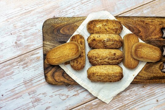 Polvorones and mantecados, traditional Christmas cakes from Andalusia, Spain, on wooden background, view from above. Copy space