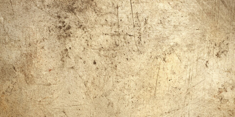 A vintage aged brown paper texture with a rough grunge surface and blank beige pattern resembles a natural stone or weathered concrete material