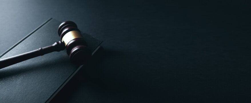 law gavel and books on wooden table background. law and justice concept.