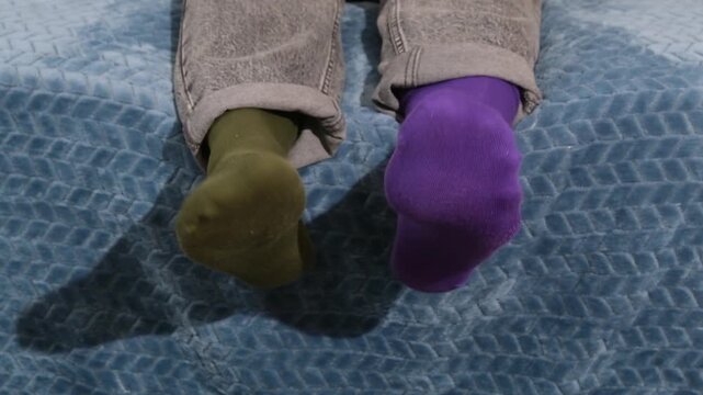 Socks symbolize diversity. Symbolic portrayal of Down syndrome awareness through mismatched socks
