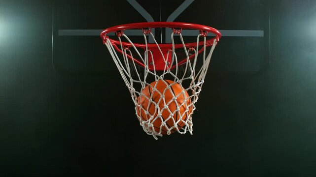 Super slow motion of basketball ball hitting the basket . Filmed on high speed cinema camera , 1000 fps , camera motion