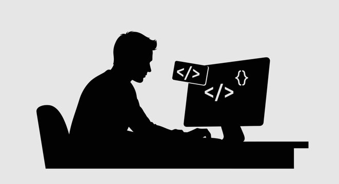 Man sitting at computer desk coding.