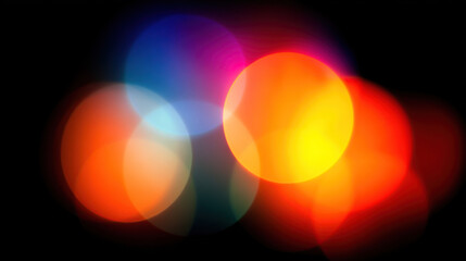 Vibrant colorful bokeh lights on dark background