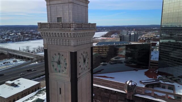 Drone orbit of Springfield clock tower with winter river and highway