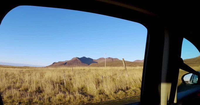 Site window pov drive on dirt road through volcanic mountain in remote wilderness on rural scene in Iceland