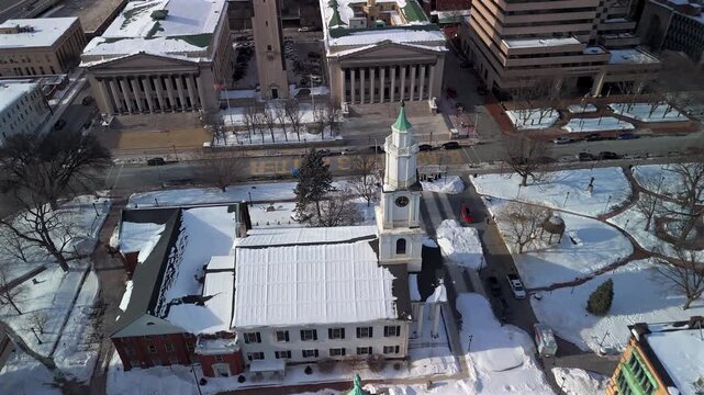 Aerial of Springfield civic center with clock tower and snowy buildings
