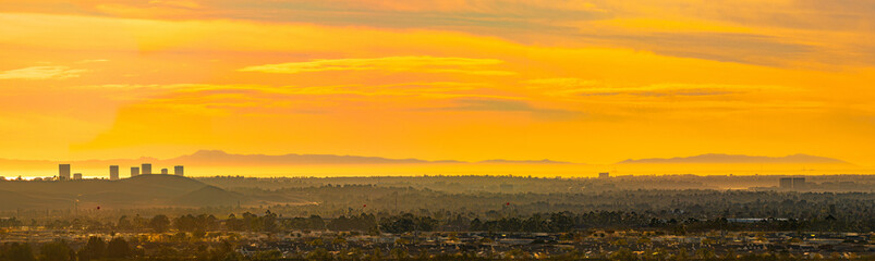 Naklejka premium Panorama of Irvine and Suburban Orange County at sunset in Southern California 