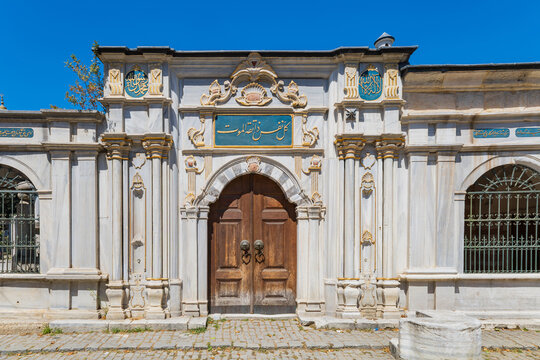 Narrow cobblestone street with tombs and imaret buildings near Ey&uuml;p Sultan Mosque in Istanbul.