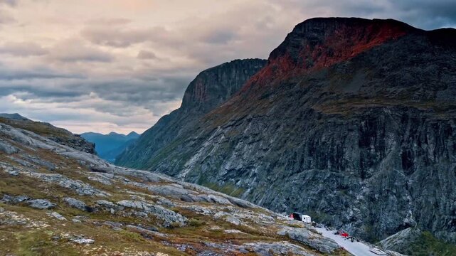 Scenic mountain landscape with dramatic cliffs and cloudy sky