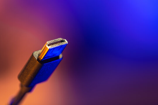 Macro hdmi connector on warm neon gradient. 4k signal.