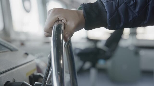 Hand on the wheel of big ship for ocean travel