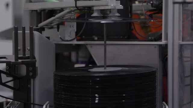 Dropping vinyl record in factory equipmen