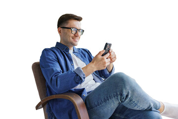 Man sitting in chair using smartphone while smiling 