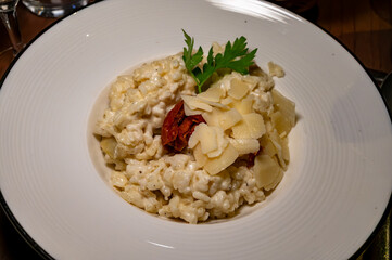 Fine dining with risotto with black truffles and parmesan cheese