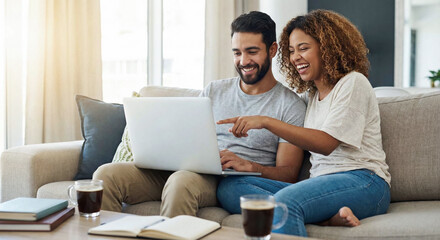 Fototapeta premium Smiling husband and wife shopping online or planning vacation on computer. E-commerce, finance and real estate concept in modern home