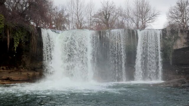 Jerea river waterfall showing the powerful flow of water over the rocky cascade in pedrosa de tobalina