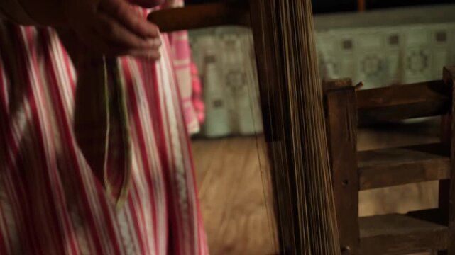 Winding flax thread onto traditional wooden frame