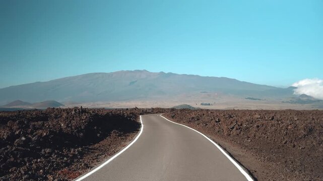 Tholeiitic basalt Lava flows (Kau Basalt) from Earth's largest active volcano Mauna Loa (Shield volcano). Pu'u Huluhulu, The Big Island (Hawaiʻi Island). Mauna Kea is in the distance.