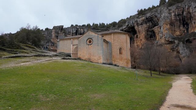 Romanesque hermitage of san bartolome standing against the backdrop of rio lobos canyon cliff