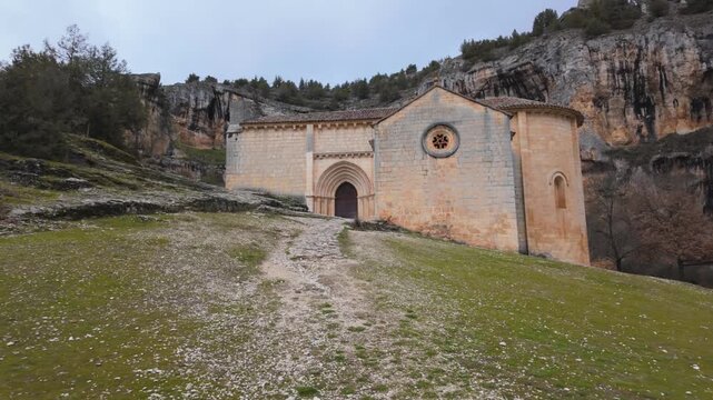 Romanesque hermitage of san bartolome standing against the backdrop of rio lobos canyon cliff