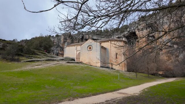 Romanesque hermitage of san bartolome standing against the backdrop of rio lobos canyon cliff