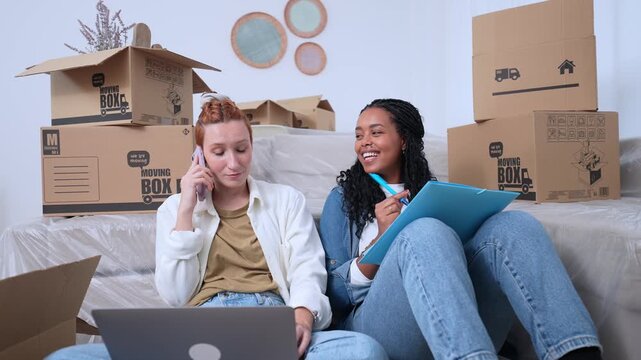 Diverse couple coordinating relocation to new home