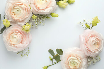 Beautiful ranunculuses and roses on white background, flat lay. Space for text