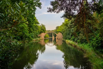 Acrylglasbilder Rakotzbrücke Rakotz Bridge at sunset (Rakotzbrucke, Devil's Bridge) in Kromlau, Saxony, Germany  © Pawel Pajor