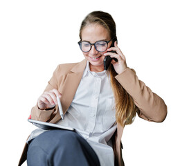 Smiling young professional woman on a phone call, simultaneously working with a tablet and stylus