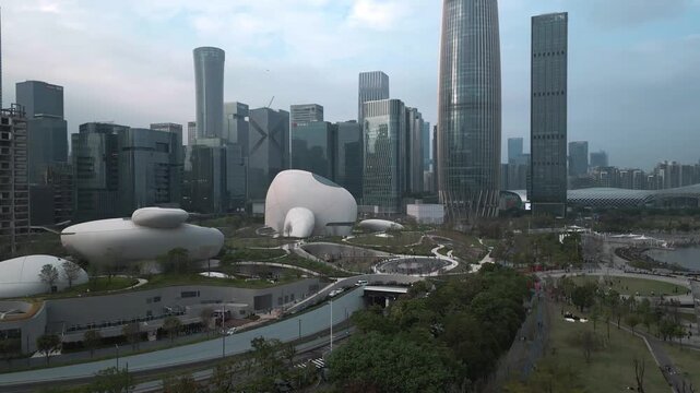 Panoramic aerial view of skyscrapers and Shenzhen Talent Park along the bay next to the Spring Bamboo China Resources Tower in downtown Shenzhen, China on a sunny day.