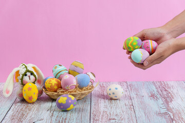 Fototapeta premium Easter bunny with colorful eggs in a cheerful atmosphere