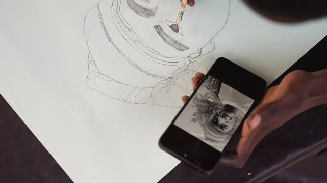 Closeup of artist matching tonal shades carefully. Fine brush technique capturing mood in detailed portrait art. Focused artist using delicate strokes to harmonize tonal values on canvas
