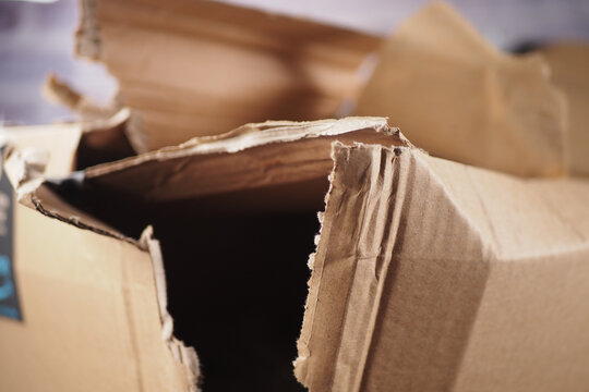 Cardboard box opened and damaged on a table