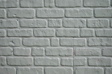Obraz premium Textured white brick wall with a simple design