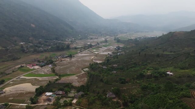 Winding mountain pass through na pheo rice fields in vietnam showcasing the natural beauty and agriculture of the region.