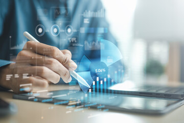Business professional using tablet with digital analytics dashboard, charts and data visualization,...