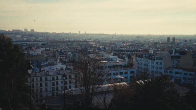 Showcasing a romantic city trip concept with a Super 8 film look Handheld shot of the Paris skyline blurry and vintage style travel b-roll urban exploration and establishing shots in editorial or comm