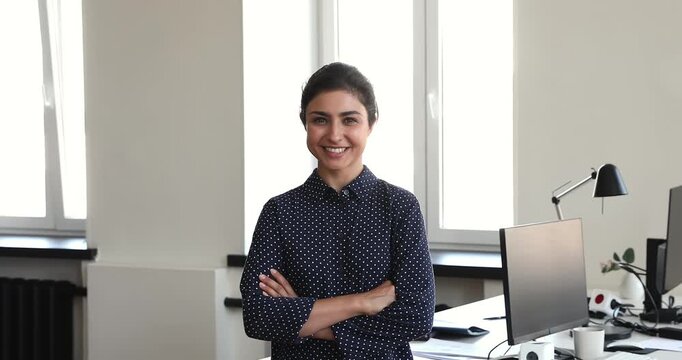 People of various genders, ages, races, cultures, occupations standing indoors, posing for portrait, getting happy, smiling. Successful professionals, freelancers, entrepreneurs, students head shots