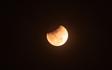The Worm Moon total lunar eclipse, the last full moon of winter, the Moon moves from right to left as it passes through Earth's shadow. The Moon was taking on a coppery red hue, known as "Blood Moon." © Soumyabrata