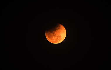 The Worm Moon total lunar eclipse, the last full moon of winter, the Moon moves from right to left as it passes through Earth's shadow. The Moon was taking on a coppery red hue, known as "Blood Moon." © Soumyabrata