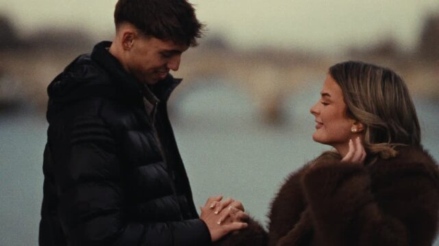 A romantic city trip A couple in love holds hands in Paris shot on Super 8 film with a handheld camera and blurry effect travel vlogs relationship content and European culture documentaries