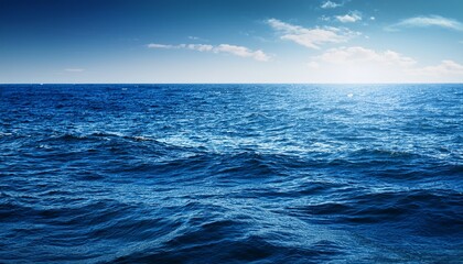 Obraz premium Vast Expanse Of Deep Blue Ocean Water Sunlit Waves Gently Rolling Towards The Horizon A Tranquil And Serene Seascape Seascape Seabed Depth