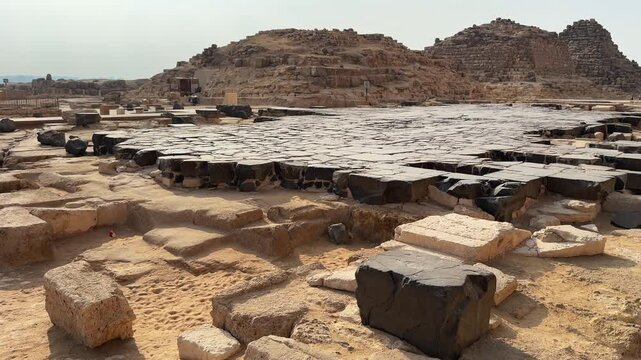 Panorama of Scattered Ancient Basalt Blocks and Ruins on the Giza Plateau near the Great Pyramid of Khufu
