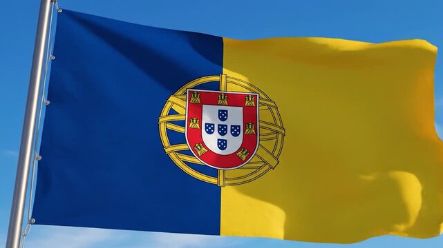 The national flag of Portugal proudly waves against a clear blue sky
