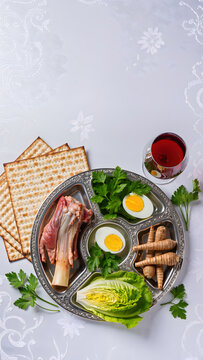 Top view of traditional Passover Seder plate with matzah wine and symbolic foods
