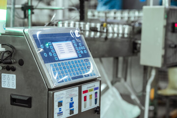 Fototapeta premium Digital control panel for lot coding system near packaging area. Concept highlights date marking compliance, supply chain tracking system and export standard regulation monitoring.